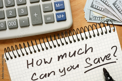 Notepad with how much can you save on a wooden table.