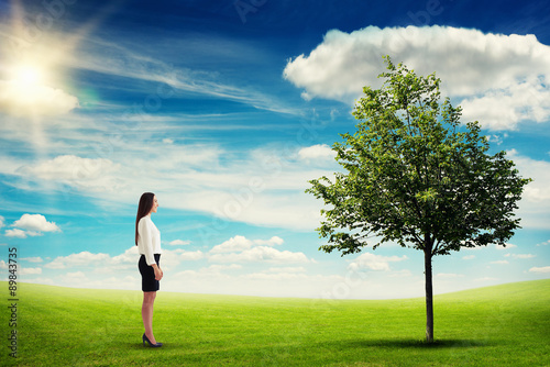 woman standing on green meadow
