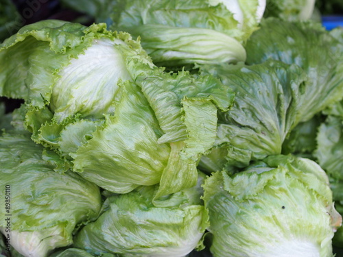 Pile of fresh iceberg lettuce. 