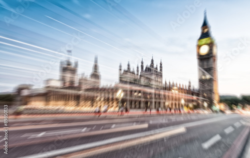Blurred moving scene at night on Westminster Bridge, London