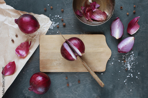 Red onion on the wooden table photo