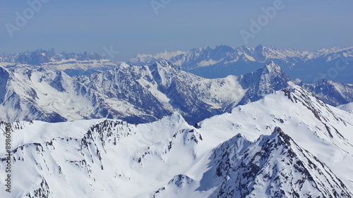 many beautiful alpine peaks in winter and white snow