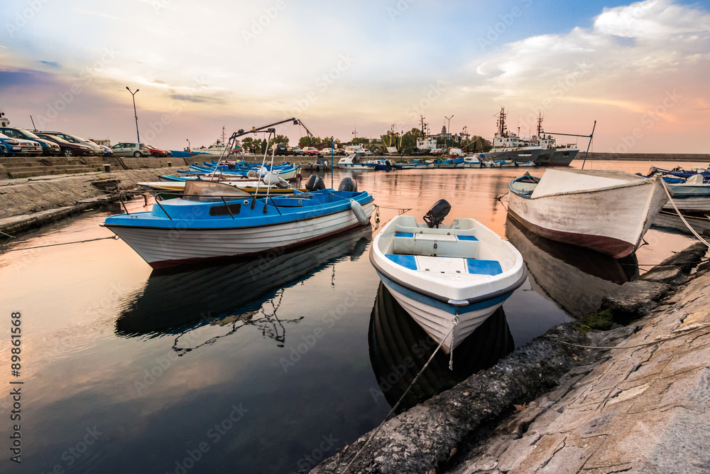 fishing boats in port of Sozopol at sunrise