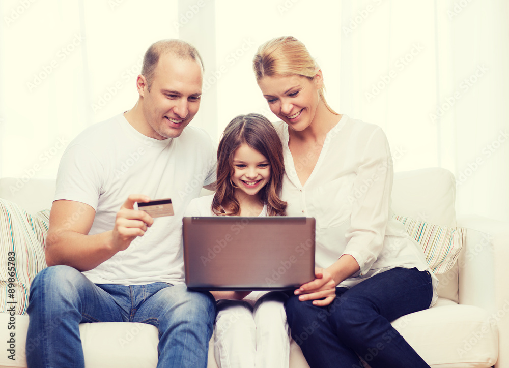 parents and girl with laptop and credit card parents and girl with laptop and credit card