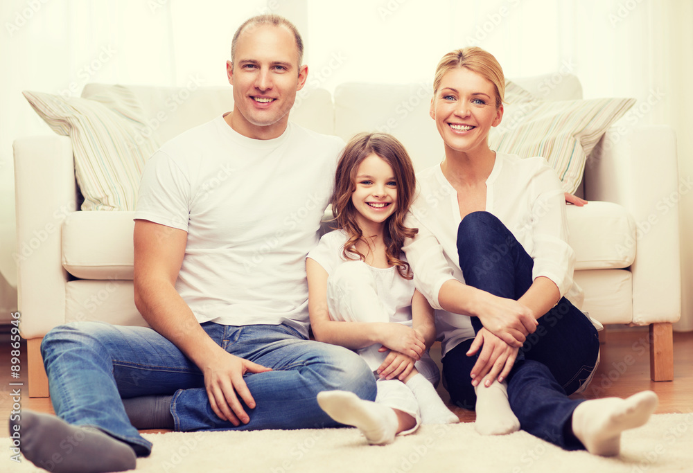 parents and little girl sitting on floor at home parents and little girl sitting on floor at home