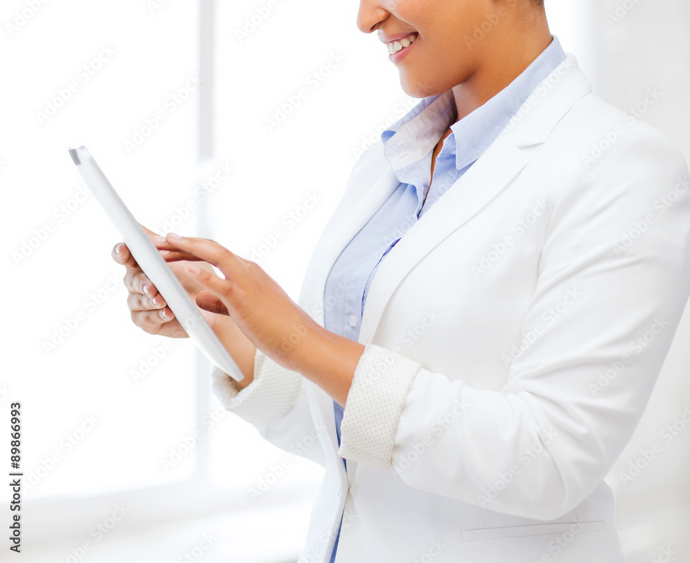 businesswoman with tablet pc in office businesswoman with tablet pc in office