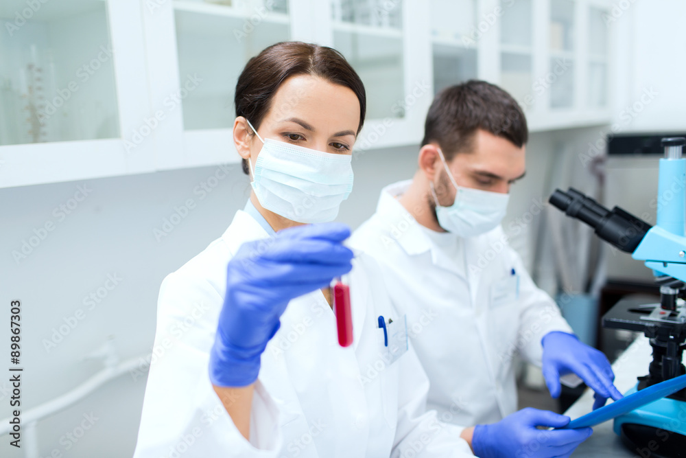young scientists making test or research in lab young scientists making test or research in lab
