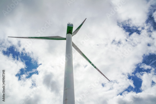 Wind generator with clouds and blue sky