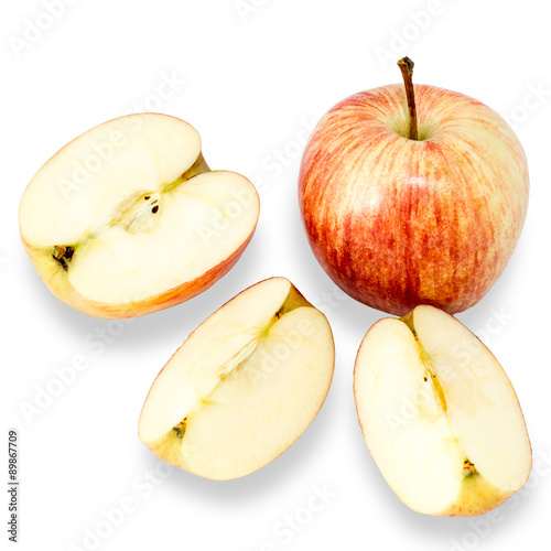 Apple and apple slices on white background.