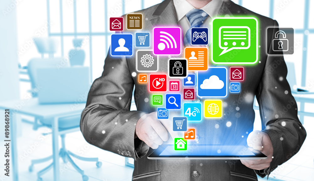 Business man using tablet PC with social media icon set Business man using tablet PC with social media icon set