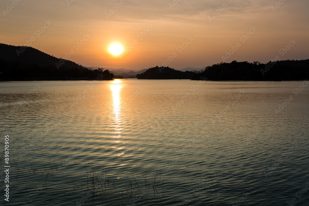 Sunset in the Lake at Kangkrajan dam Thailand.