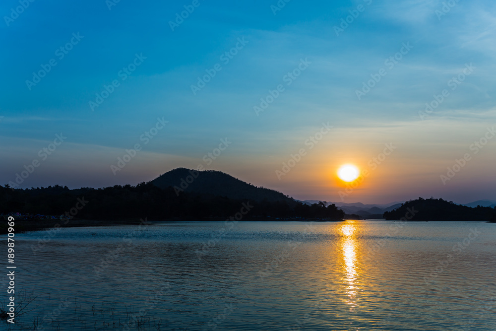Sunset in the Lake at Kangkrajan dam Thailand.