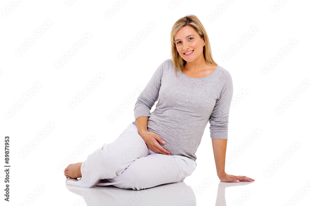 pregnant woman sitting on the floor isolated pregnant woman sitting on the floor isolated