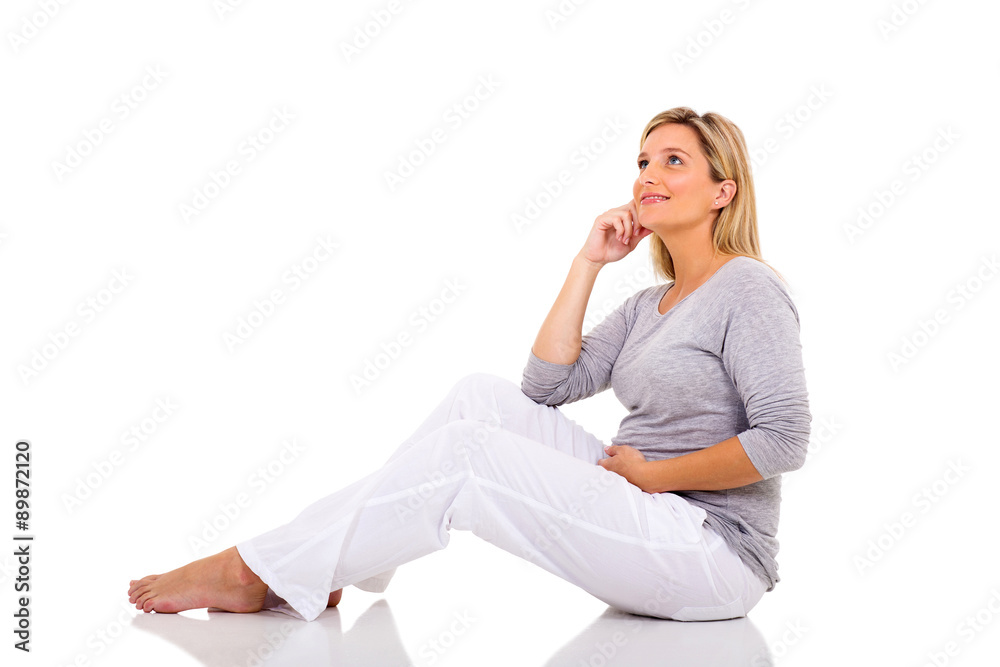 thoughtful pregnant woman sitting on floor thoughtful pregnant woman sitting on floor