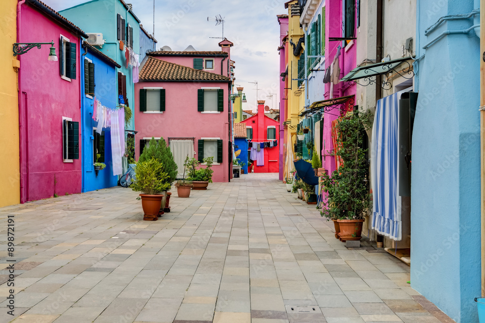 Colorful houses of Burano island with laundry