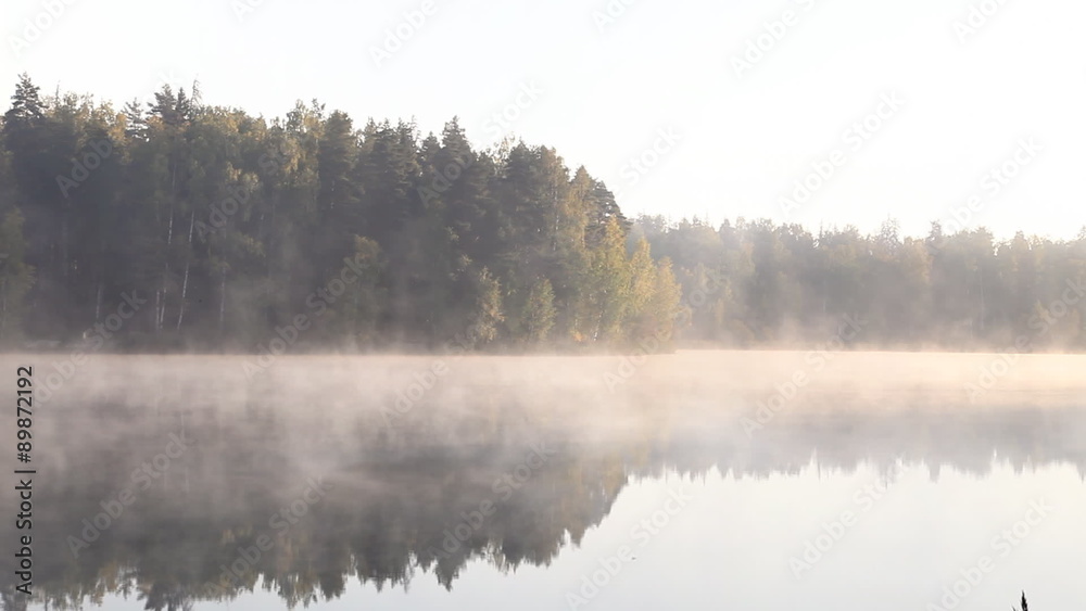 Beautiful Autumn Fall landscape over foggy misty lake. Fast motion Beautiful Autumn Fall landscape over foggy misty lake. Fast motion