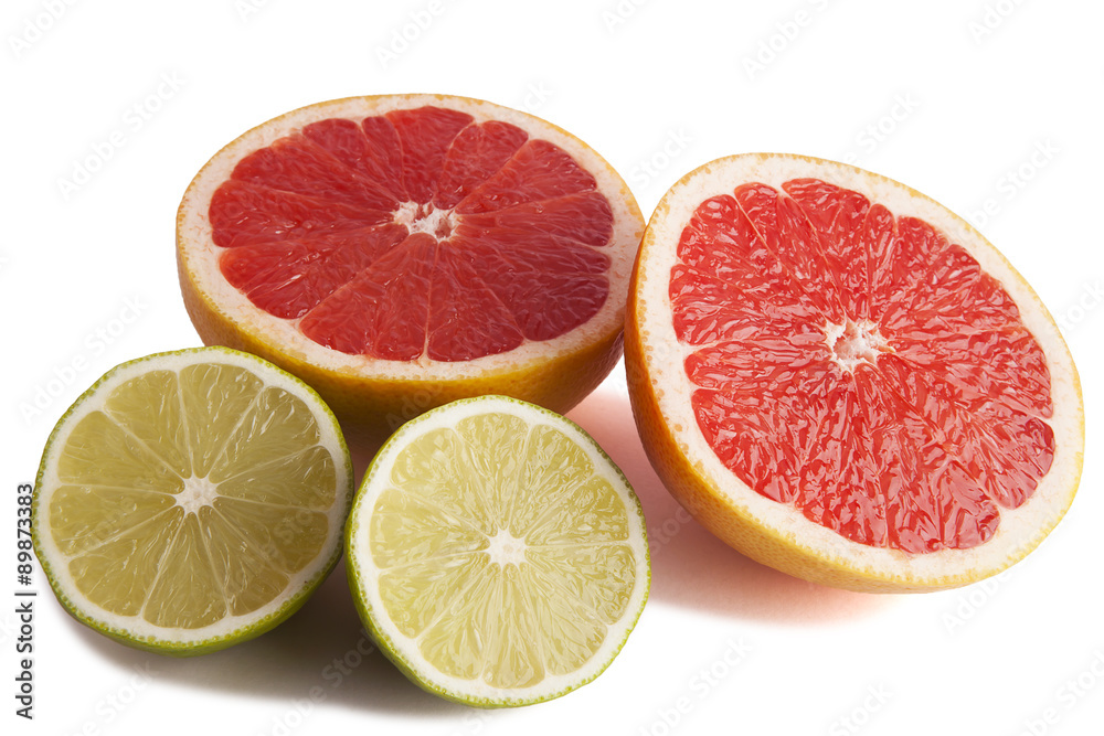 Fresh lime and grapefruit cut in half. Fresh lime and grapefruit cut in half.
