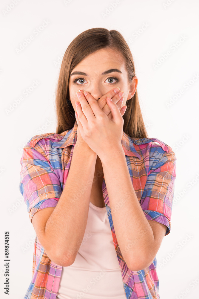 young woman covering her mouth young woman covering her mouth
