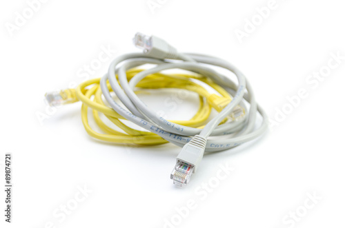 Close up of network cable and plugs on white background