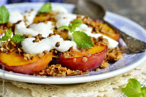Grilled peachs with granola and whipped cream.