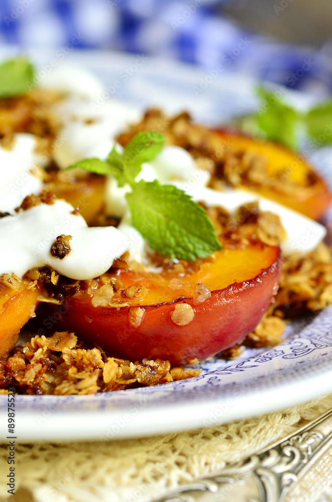 Grilled peachs with granola and whipped cream.