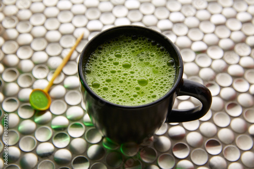 Matcha green tea from Japan on stainless steel photo