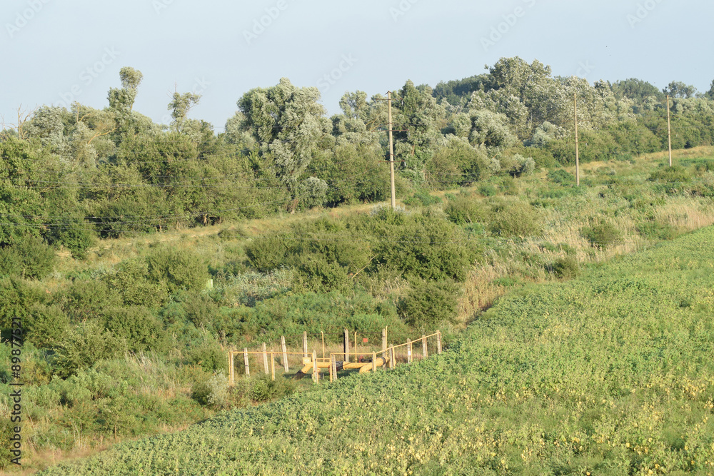 Naklejka premium The gas pipeline through the small river
