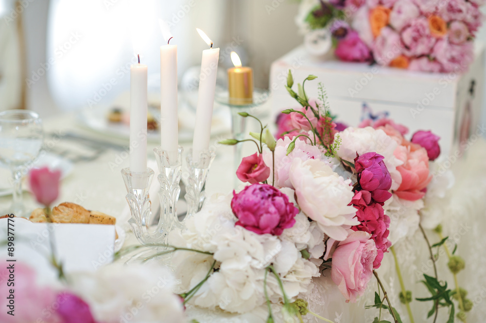 Arrangement of pink and white flowers in restaurant for luxury wedding event Arrangement of pink and white flowers in restaurant for luxury wedding event
