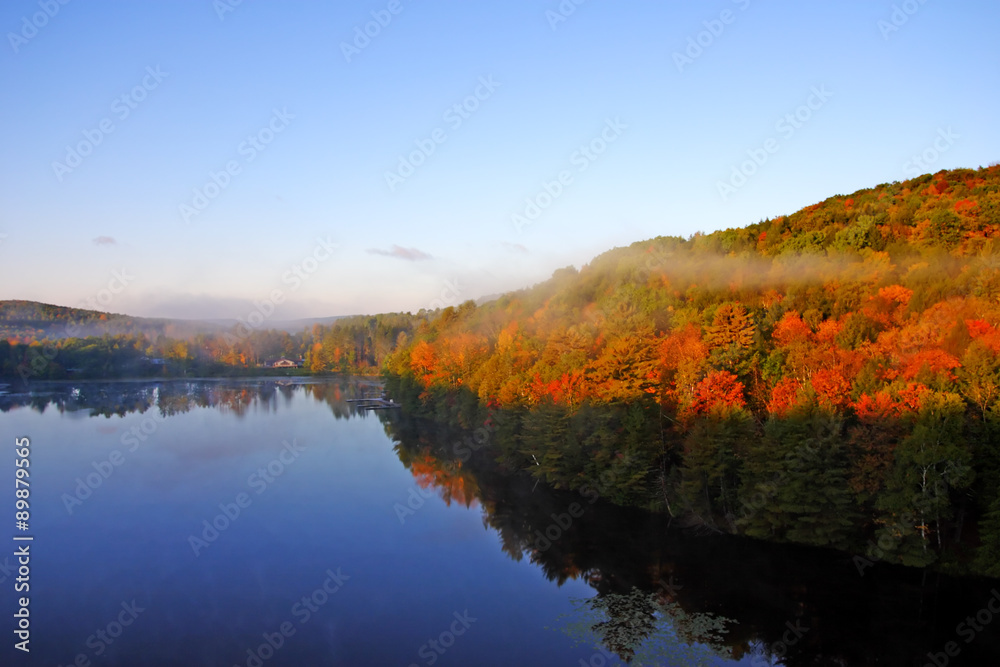 An aerial view of a hot air balloon floating over the Vermont country side ..