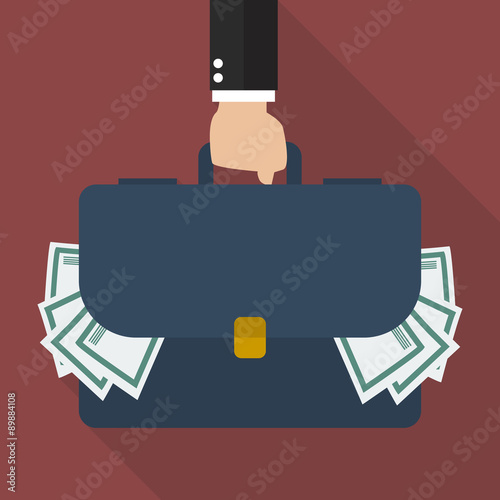 Businessman hand holding briefcase full of money