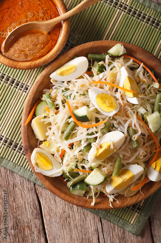 Traditional Indonesian salad gado-gado closeup. vertical top view 
 photo