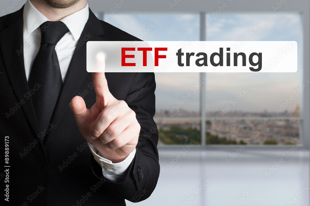 businessman pushing touchscreen button etf trading businessman pushing touchscreen button etf trading