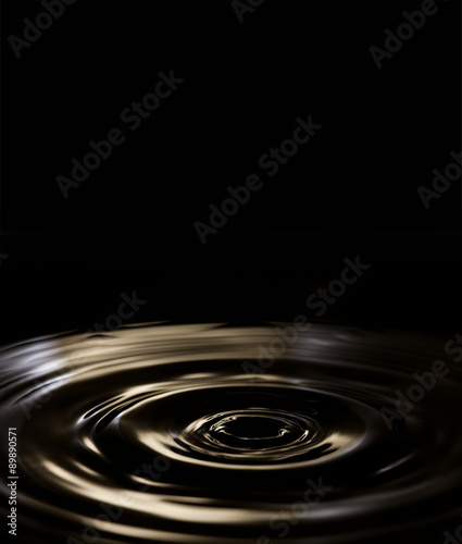 Liquid splash. Dark circles. Black background