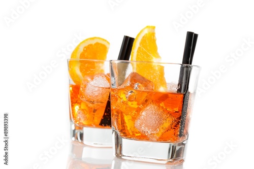 two glasses of spritz aperitif aperol cocktail with orange slices and ice cubes