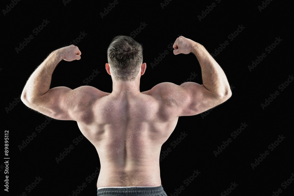 Strong bodybuilder with arms up