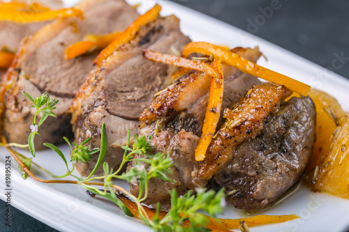 Roasted duck breast in orange on the plate