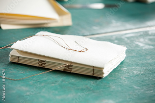 Thread And Papers On Table In Factory photo