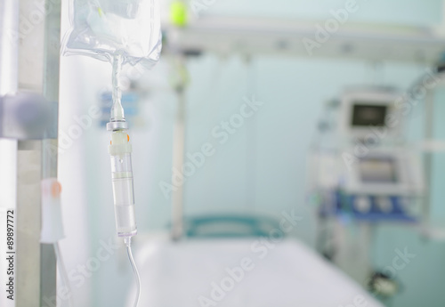 Iv drip on the background of blurred hospital ward