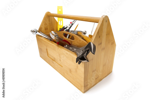 Wooden toolbox with tools isolated on white
