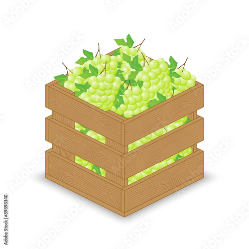 Green white grapes in wooden crate