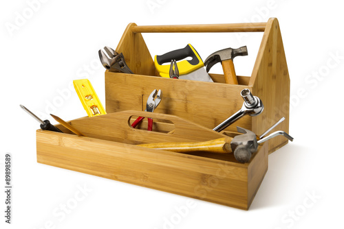 Wooden toolbox with tools isolated on white
