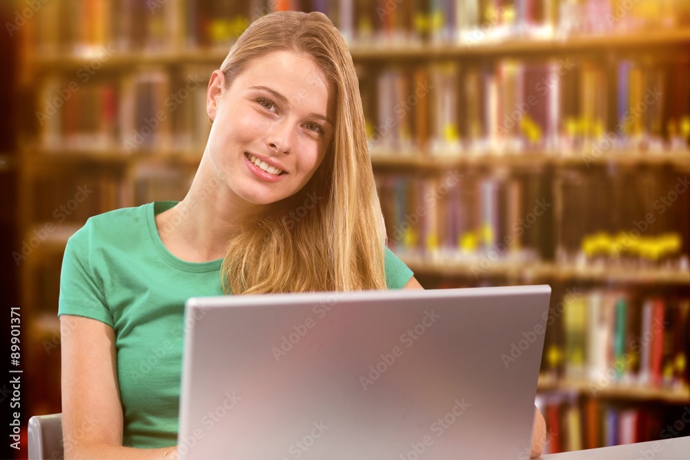 Composite image of student on laptop Composite image of student on laptop