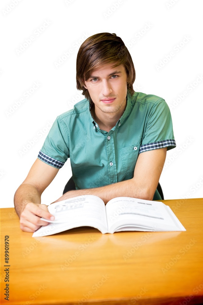 Composite image of student sitting in library reading Composite image of student sitting in library reading
