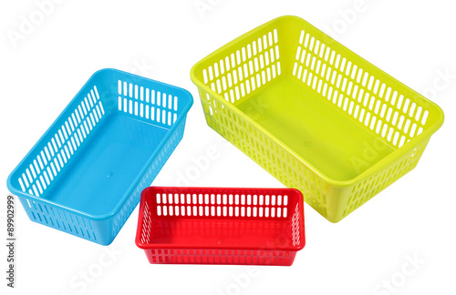 Several small different colored plastic baskets for household us photo