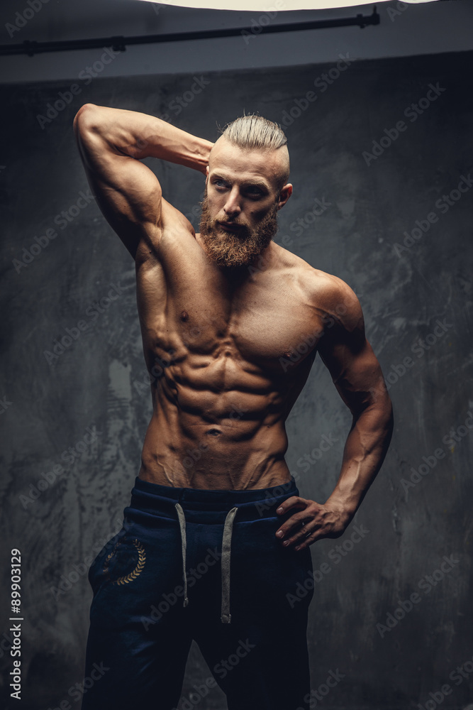 Obraz premium Shirtless muscular bodybuilder with beard