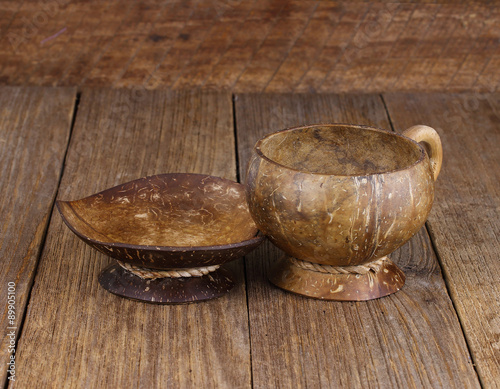  coconut shell coffee cup on old wooden background