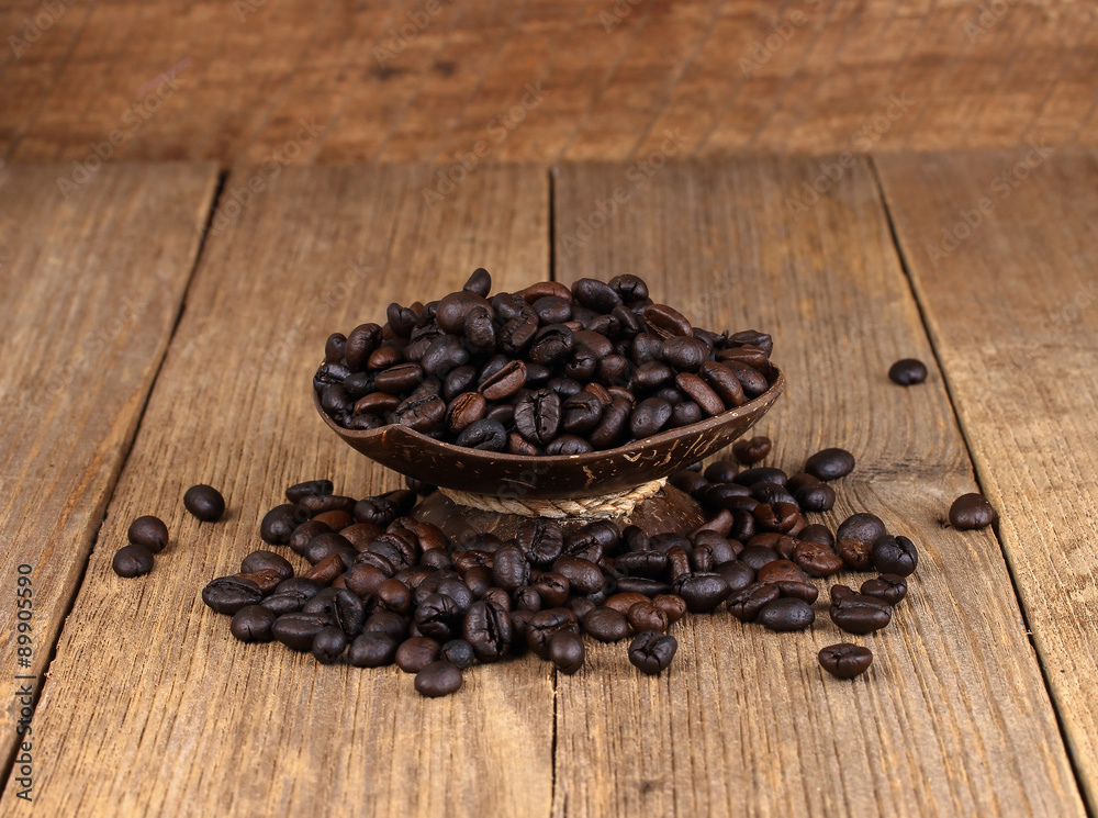 Coffee beans on wooden background Coffee beans on wooden background