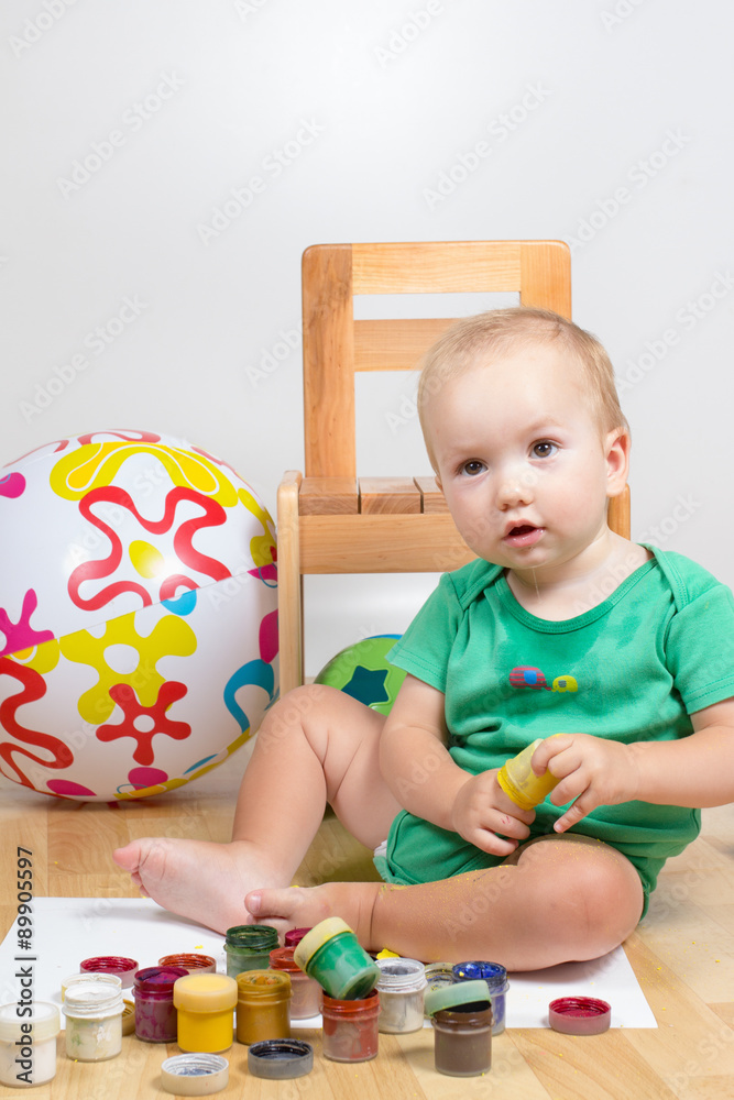 kid trying to draw a colorful old paints Isolated on white kid trying to draw a colorful old paints Isolated on white