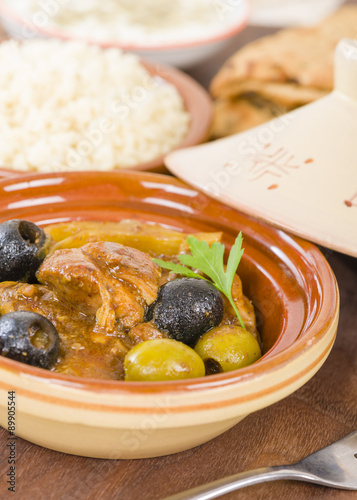 Chicken Tagine - Moroccan chicken tagine with olives, preserved lemon and fennel, served bulgur wheat. 