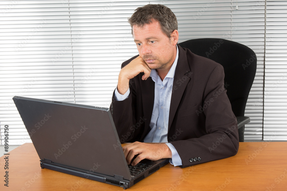 Man with Beard Working on Laptop isolated on a White Background Man with Beard Working on Laptop isolated on a White Background